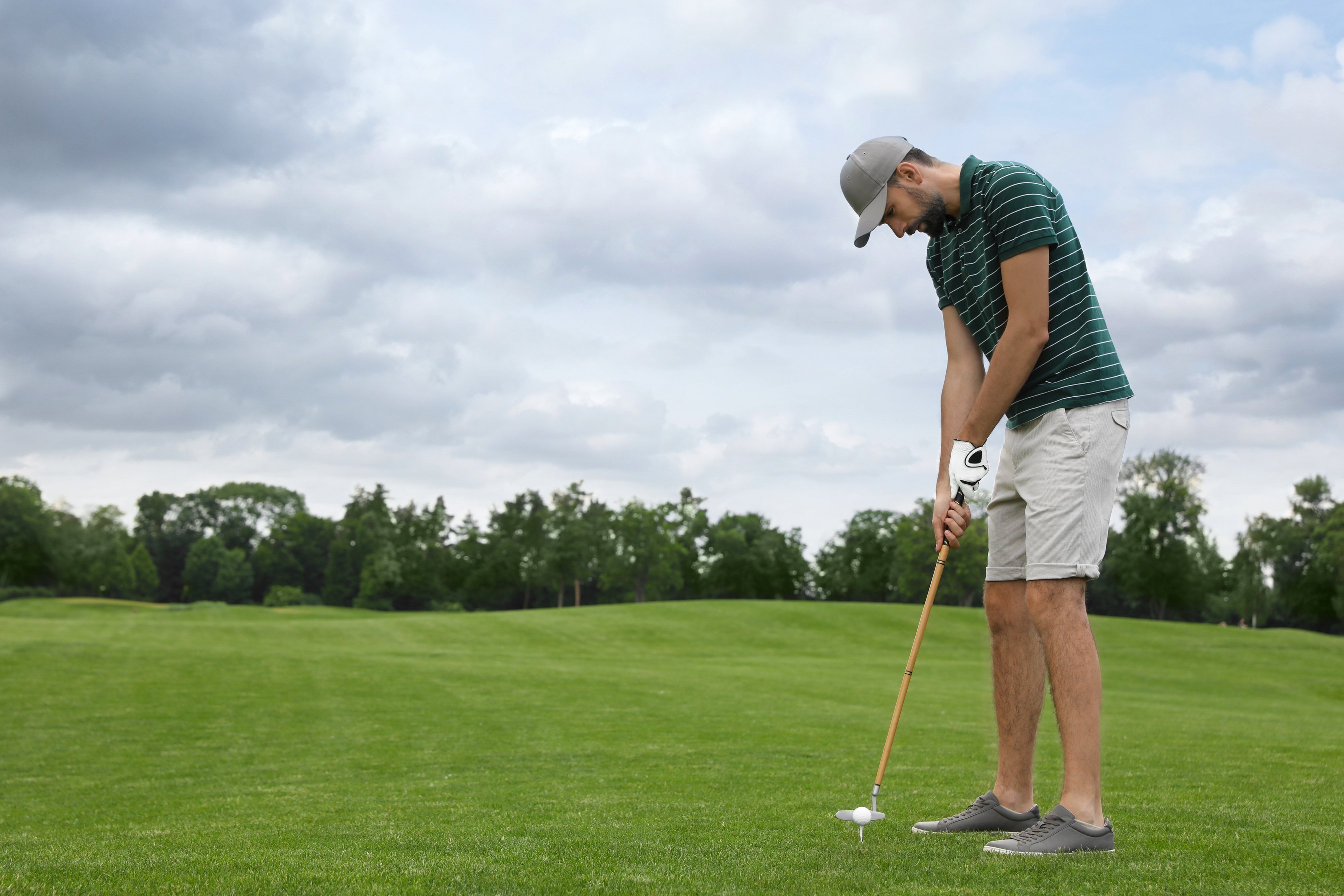 Man Playing Golf on Green Course. Sport and Leisure